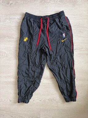 Nike NBA 75 Miami Heat Black Joggers with Red Drawstrings and Yellow Logos